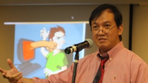 Sonnie Santos giving a talk at Norton's 2013 Report Press briefeing. Photo courtesy of Technoodling